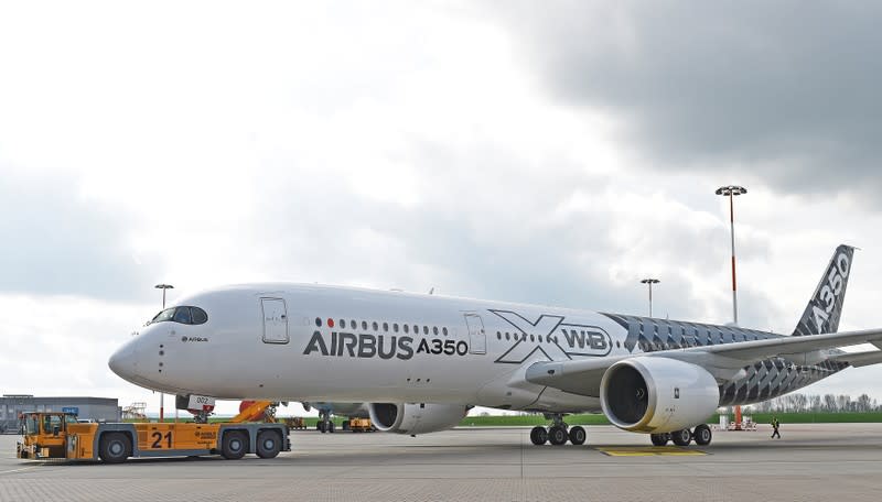 FILE PHOTO: An Airbus A350 XWB flight-test aircraft is towed during a media-day at the German headquarters of aircraft company Airbus in Hamburg-Finkenwerder