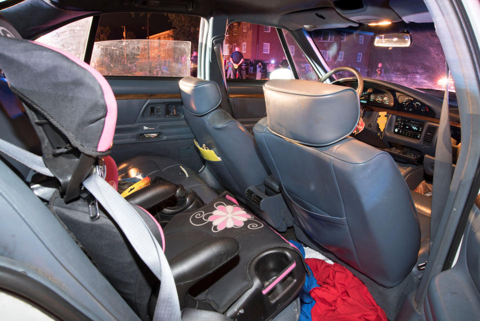 A child's car seat is seen at the rear of Philando Castile's car.&nbsp;