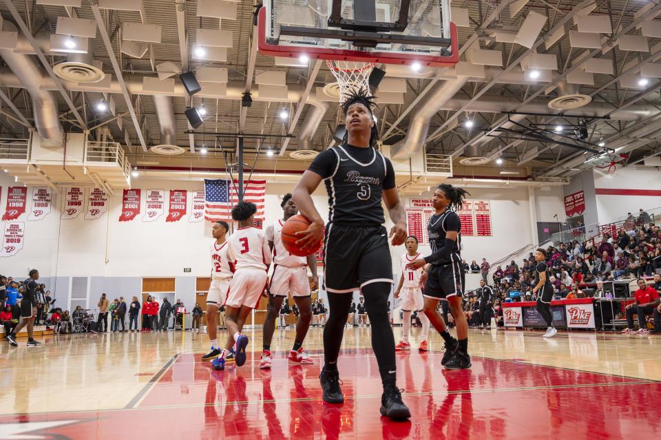 Lawrence Central High School senior Bryson Luter (3) reacts after drawing a foul during the second half of an IHSAA basketball game, Friday, Dec. 15, 2023, at Pike High School. Officials ended the game with 4:51 left on the clock after an altercation on the court. Lawrence Central High School won, 69-55.