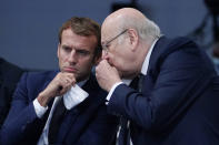 Lebanese Prime Minister Najib Mikati, right, speaks with French President Emmanuel Macron during the COP26 U.N. Climate Summit, Monday, Nov. 1, 2021, in Glasgow, Scotland. (AP Photo/Evan Vucci, Pool)