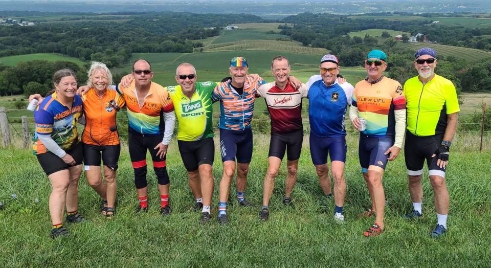 Roger Gray, fourth from right, is pictured with a biking group on the bluffs near Dubuque, Iowa near the Mississippi River. The group biked the length of the river last summer.