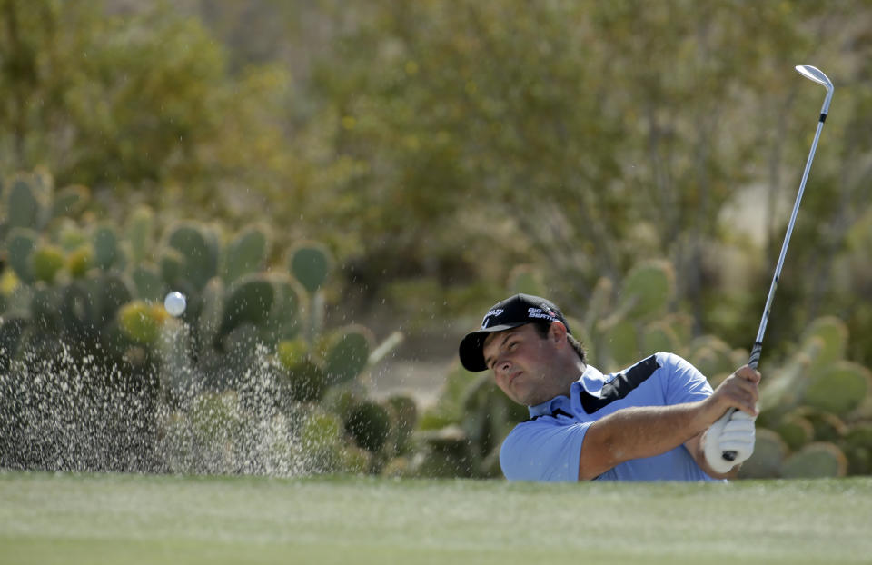 Patrick Reed watches his sand shot on the 16th hole during a practice round for the Match Play Championship golf tournament on Tuesday, Feb. 18, 2014 in Marana, Ariz. (AP Photo/Chris Carlson)