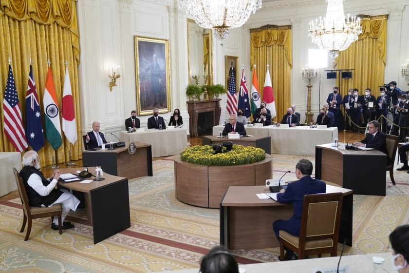 President Joe Biden speaks during the Quad summit in the East Room of the White House, Friday, Sept. 24, 2021, in Washington. Seated clockwise from left, Indian Prime Minister Narendra Modi, Biden, Australian Prime Minister Scott Morrison, Secretary of State Antony Blinken and Japanese Prime Minister Yoshihide Suga. (AP Photo/Evan Vucci)