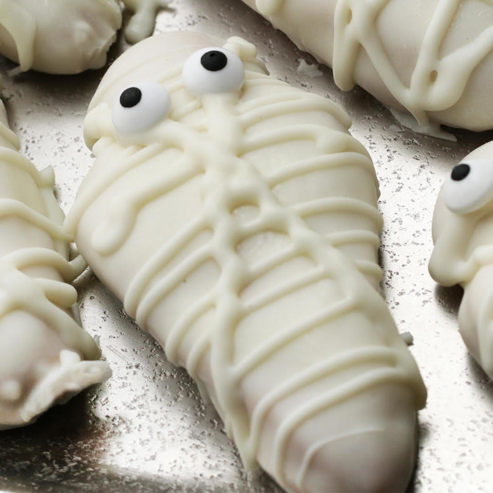 mummy decorated cookies on a baking sheet