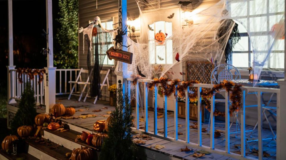 halloween jack o lantern pumpkins on a porch stairs