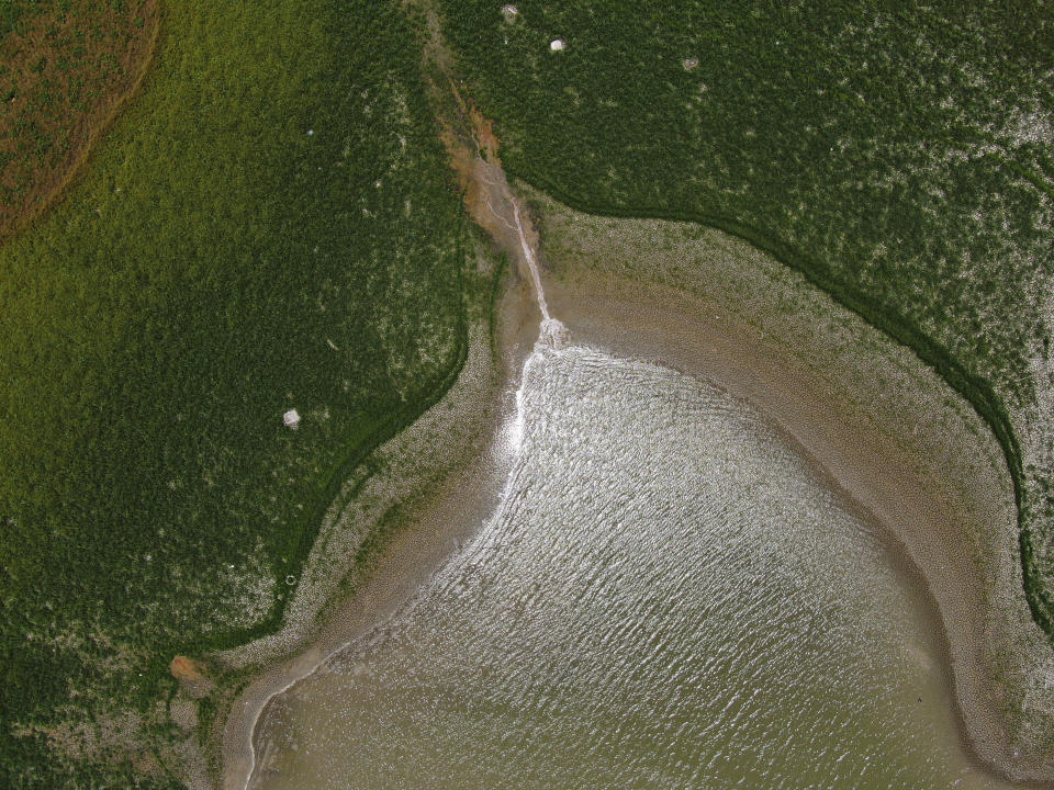 A view of The Boca reservoir that supplies water to the northern city of Monterrey is almost dry as the northern part of Mexico is affected by an intense drought, in Santiago, Mexico, Saturday, July 9, 2022. Local authorities began restricting water supplies in March, as a combination of an intense drought, poor planning and high use has left the three dams that help supply the city dried up, with thousands of homes not receiving any water for weeks. (AP Photo/Fernando Llano)