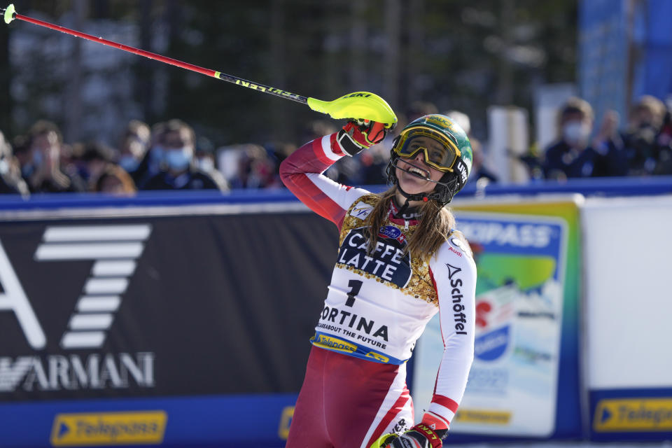 Austria's Katharina Liensberger celebrates after winning the women's slalom, at the alpine ski World Championships in Cortina d'Ampezzo, Italy, Saturday, Feb. 20, 2021. (AP Photo/Giovanni Auletta)