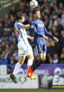 <p>Huddersfield Town’s Christopher Schindler, left, and Tottenham Hotspur’s Dele Alli leap for the ball during the English Premier League soccer match between Huddersfield Town and Tottenham Hotspur at the John Smith’s Stadium, Huddersfield, England. Saturday, Sept. 30, 2017 (Nigel French/ PA Via AP) </p>