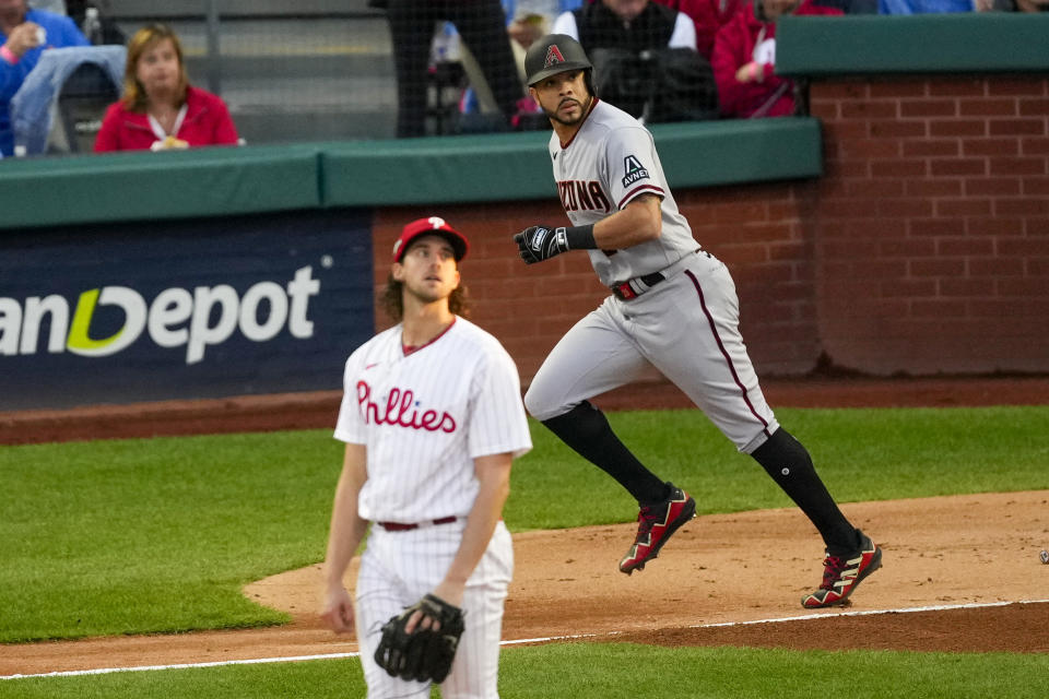 The Arizona Diamondbacks' Tommy Pham watches his home run off Philadelphia Phillies starter Aaron Nola during the second inning of Game 6 of the NLCS on Monday. (AP Photo/Matt Rourke)