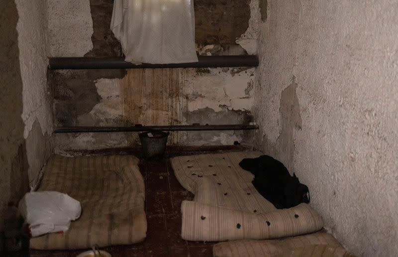 A view of a cell with mattresses on the floor at a police station in the town of Izium