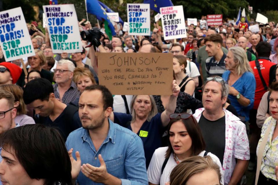 Anti-Brexit supporters take part in a protest at College Green (AP)