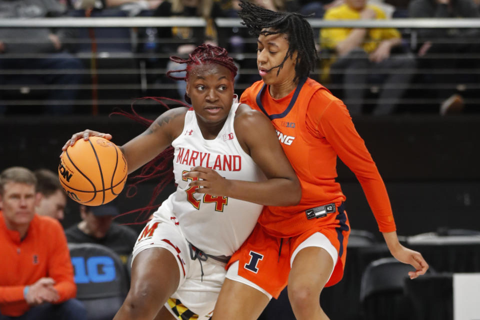 Maryland guard Bri McDaniel (24) drives around Illinois guard Jada Peebles during the first half of an NCAA college basketball game at the Big Ten women's tournament Friday, March 3, 2023, in Minneapolis. (AP Photo/Bruce Kluckhohn)