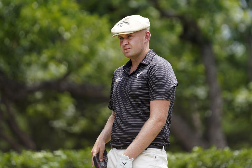 Harry Hall, of England, prepares for a tee shot on the second hole during the final round of the Charles Schwab Challenge golf tournament at Colonial Country Club in Fort Worth, Texas, Sunday, May 28, 2023. (AP Photo/LM Otero)