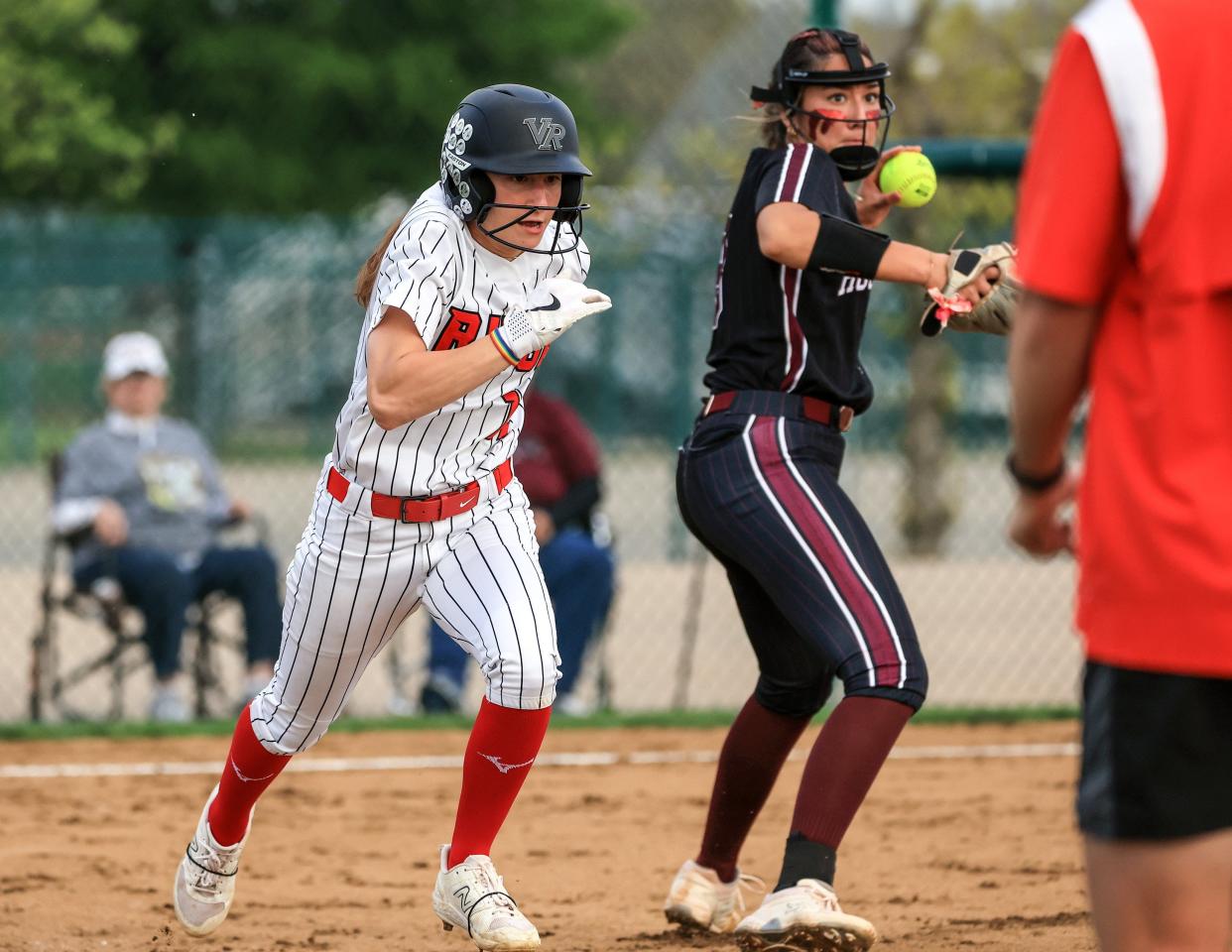 Vista Ridge's Reagan Pavesi tries to beat out Round Rock pitcher Maddy Azua's throw to first base on a bunt play during their March 22 game. The Dragons won that game 1-0, but the Rangers closed out District 25-6A play with a 1-0 win over the Dragons last Friday, Round Rock's first district loss of the season.