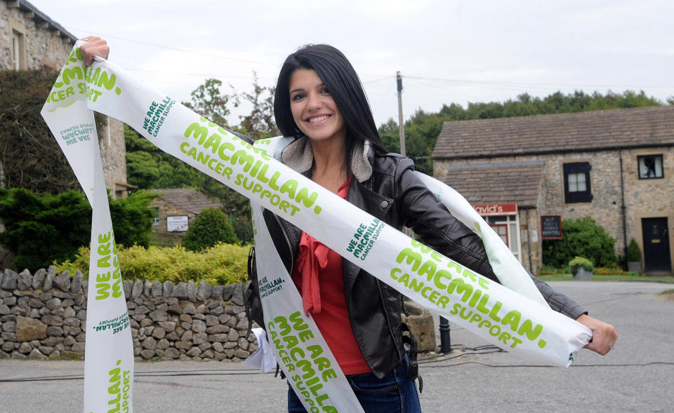 Emmerdale actress Natalie Anderson lends her support at the start of the Macmillan Emmerdale to Eastenders Cycle Challenge on the Emmerdale set just outside Leeds.   (Photo by Anna Gowthorpe/PA Images via Getty Images)