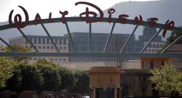 walt disney earnings theme parks espn lone ranger movie flop