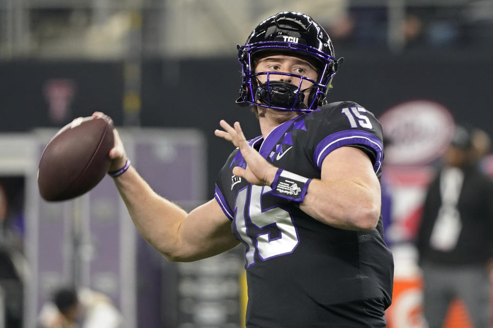 TCU quarterback Max Duggan (15) throws before the Big 12 Conference championship NCAA college football game against Kansas State for the Big 12 Conference championship in Arlington, Texas, Saturday, Dec. 3, 2022. (AP Photo/LM Otero)