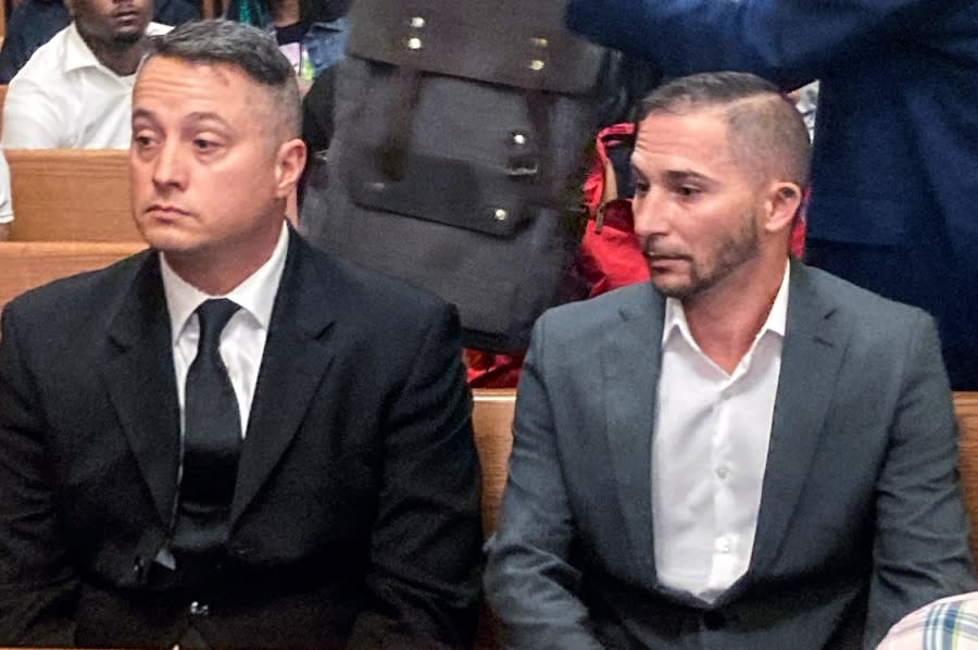 Jacob Runyan, left, and Chase Cominsky, sit in court as they are arraigned, Wednesday, Oct. 26, 2022, in Cleveland. The two pleaded not guilty to cheating and other charges in a lucrative fishing tournament on Lake Erie in the end of September where they were accused of stuffing five walleye with lead weights and fish filets. (AP Photo/Mark Gillispie)