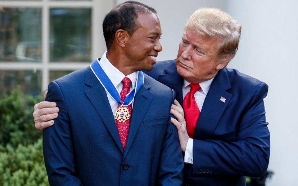 Woods was honoured by Trump at the White House in 2019 - REX