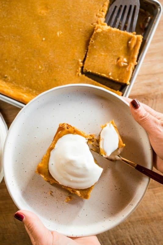 <p>Reluctant Entertainer</p><p>Pie in bar form. </p><p><strong>Get the recipe: </strong><a href="https://reluctantentertainer.com/pumpkin-pie-squares-recipe/" rel="nofollow noopener" target="_blank" data-ylk="slk:Pumpkin Pie Squares;elm:context_link;itc:0;sec:content-canvas" class="link rapid-noclick-resp"><strong>Pumpkin Pie Squares</strong></a></p>