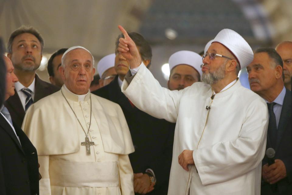 Pope Francis listens to Rahmi Yaran Mufti of Istanbul during visit to the Sultan Ahmet mosque, popularly known as the Blue Mosque, in Istanbul