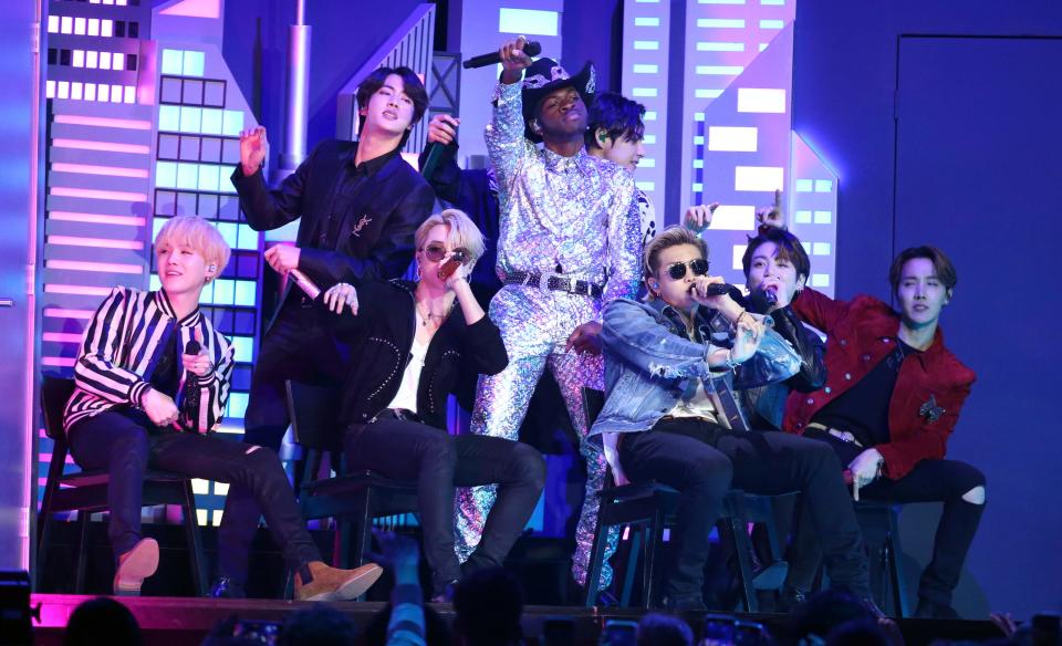 Lil Nas X, background center, and members of BTS perform "Old Town Road" at the 62nd annual Grammy Awards on Sunday, Jan. 26, 2020, in Los Angeles.