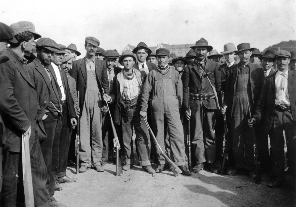 This 1914 photo provided by the Denver Public Library, Western History Collection, shows coal miners prepared to confront federal troops in Camp Rafael near Trinidad, Colo. April 20th marks the 100th anniversary of the Ludlow Massacre where 11 children and 2 women died in a fire after a battle between striking miners and the Colorado National Guard. (AP Photo/Denver Public Library, Western History Collection)