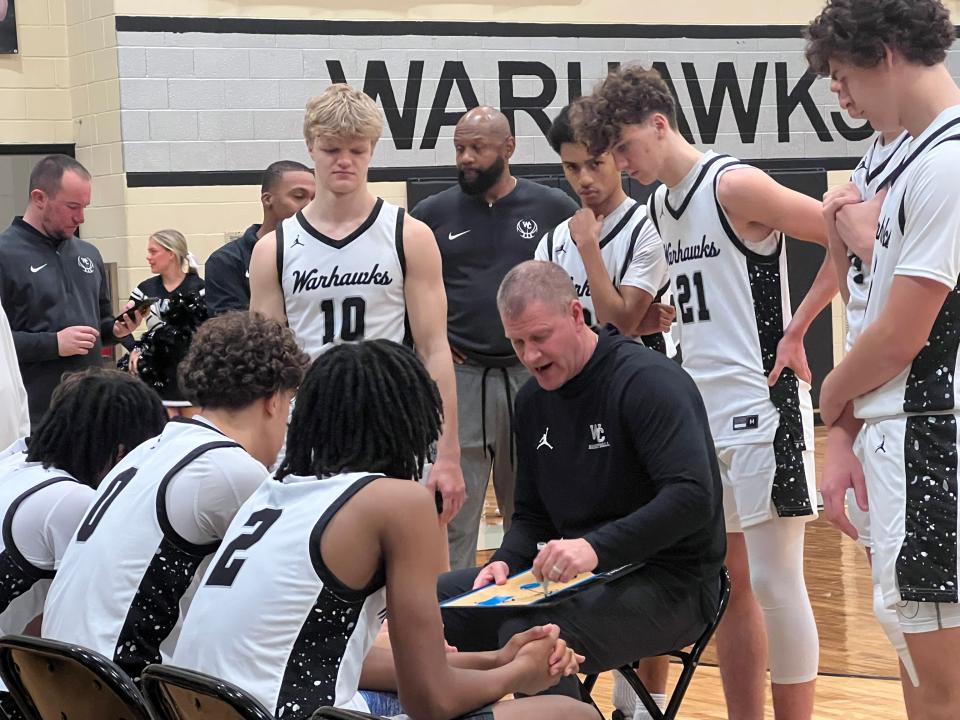 Westerville Central coach Kevin Martin designs a play during a 69-44 win against visiting Dublin Jerome on Dec. 28.