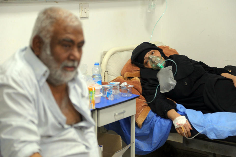 Coronavirus patients receive treatment at a hospital in Najaf, Iraq, Wednesday, July 14, 2021. Infections in Iraq have surged to record highs amid a third wave spurred by the more aggressive delta variant, and long-neglected hospitals suffering the effects of decades of war are overwhelmed with severely ill patients. (AP Photo/Anmar Khalil)