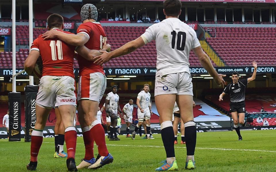 Referee Pascal Gauzere awards the Josh Adams try as George Ford protests - AFP