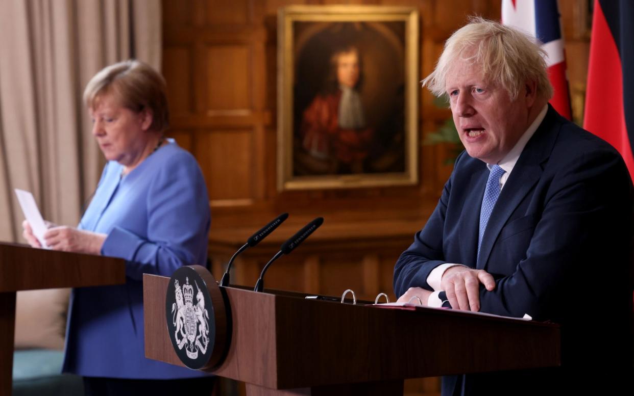 Prime Minister Boris Johnson and German Chancellor Angela Merkel - Jonathan Buckmaster/WPA Pool/Getty Images