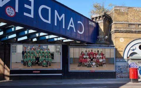 Year 3 pupils on a billboard at Camden Road station