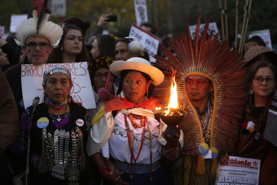 Demonstrators gather before marching in Madrid on the sidelines of UN climate talks, on Friday Dec. 6, 2019. (AP Photo/Paul White)