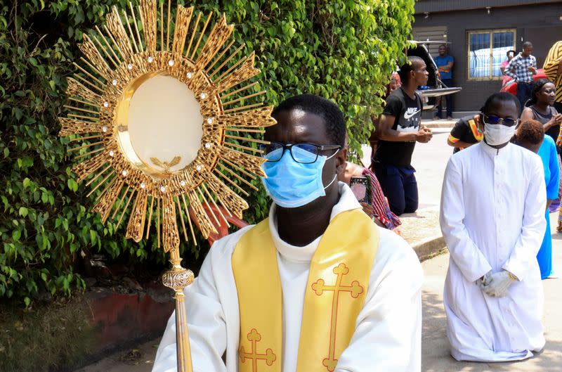 Abbe Abekan travels around the streets as he prays to stop the spread of coronavirus disease (COVID-19), in Abidjan