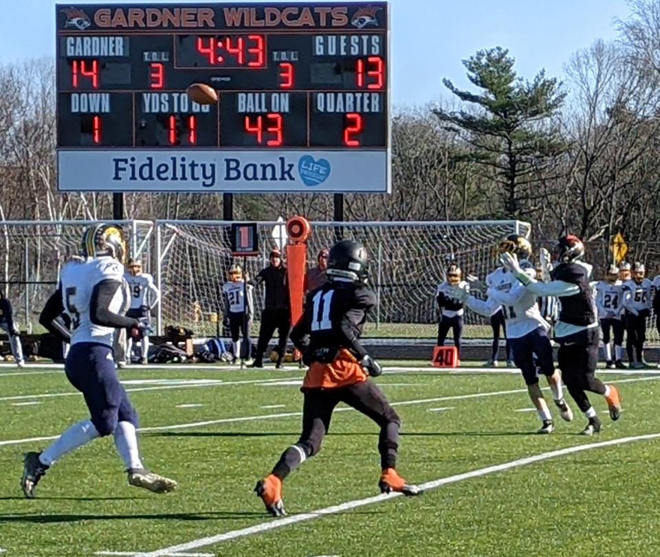 Quabbin wide receiver Bryce Venne (11) and Gardner High's Nick Delvalle move to make a play on the Panthers' pass attempt during Thursday's game at Watkins Field in Gardner. Delvalle nearly intercepted the pass which fell incomplete.