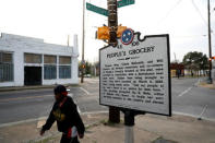 A marker on a street corner in the Soulsville neighbourhood marks the spot of the People's Grocery lynching of African-American proprietors Thomas Moss, Calvin McDowell and Will Stewart in 1892, which spurred Ida B. Wells in her crusade against lynching, in Memphis, Tennessee, U.S. March 26, 2018. REUTERS/Jonathan Ernst