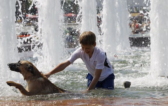 A boy plays in a fountain in Moscow during a record-shattering heat wave in July, 2010.