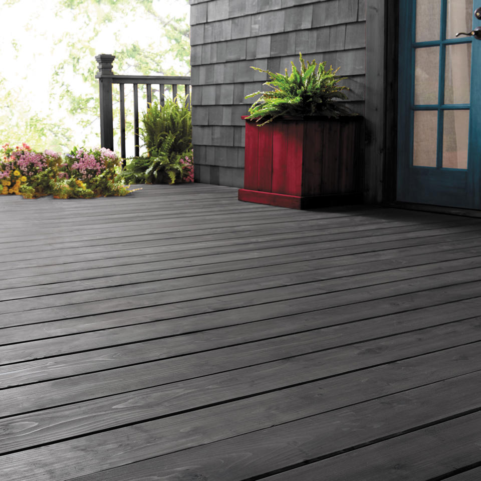 <p> Make a statement by painting your decking to match the colour of your home. </p> <p> 'When repainting a decking area, preparing your surface is really important to enable you to get the best finish,' advises Will Thompson, head of product marketing at Valspar Paint. 'First, clear away all items such as plant pots. Then remove any loose or flaking with paint stripper or by sanding. Then clean your decking with a stiff bristled brush or broom.' </p> <p> 'Holes or cracks in the wood can be easily repaired with a wood filler. Once the filler is dry, use sandpaper to sand down the whole surface. To remove the leftover dust and give the whole deck a final clean, wipe it with a decking cleaner and let it dry. If you notice spots of bare wood after removing flaking paint, or if you’re drastically changing the colour (for example, going from a dark shade to a lighter one), you will need to apply a primer and undercoat first.' </p> <p> 'Once this is dry, it’s time to give your decking a new colourful life. For painting choose the application method that better suits your need among a paint roller or a decking pad. They will both deliver a uniform yet vivid coat of paint. On the other hand, keep brushes for painting in restricted spots.' </p>
