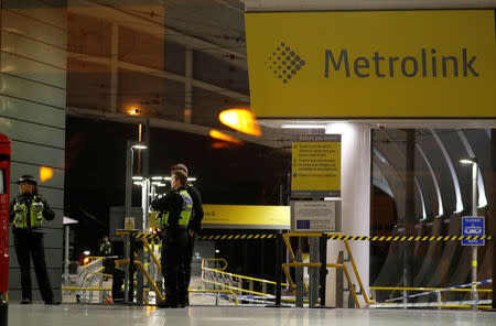 Police officers stand at the end of a tram platform following a stabbing at Victoria Station in Manchester, Britain, January 1, 2019. REUTERS/Phil Noble