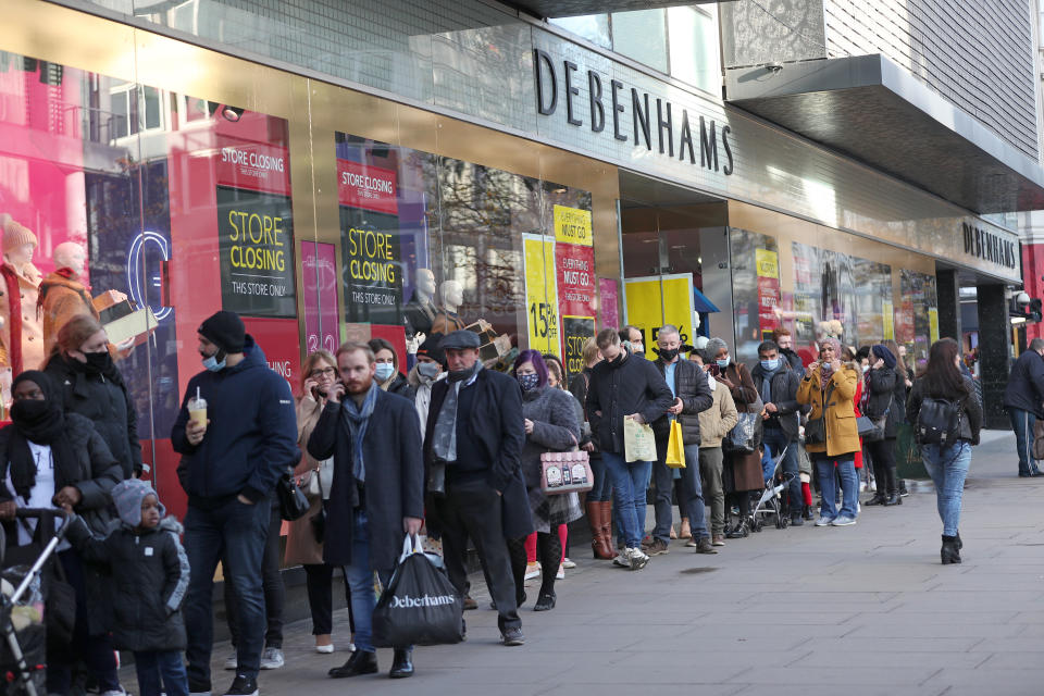 Shoppers queue outside Debenhams on Oxford Street in London on the first weekend following the end of the second national lockdown in England, with coronavirus restrictions being relaxed. (Photo by Yui Mok/PA Images via Getty Images)