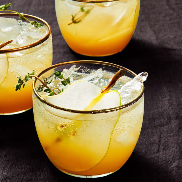 <p>These fizzy fall drinks are made with pear syrup infused with honey and thyme. Everyone at your Halloween party is sure to love them. </p><p>Get the <a href="https://www.goodhousekeeping.com/food-recipes/a38474802/pear-gin-fizz-recipe/" rel="nofollow noopener" target="_blank" data-ylk="slk:Pear Gin Fizz recipe;elm:context_link;itc:0;sec:content-canvas" class="link "><strong>Pear Gin Fizz recipe</strong></a>. </p>