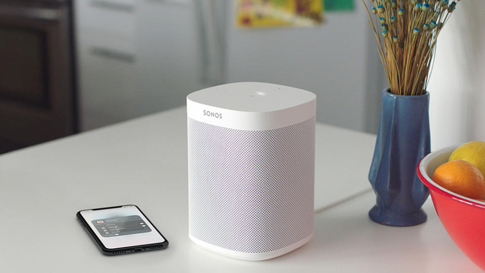 A white Sonos One streaming music over wi-fi from an iPhone