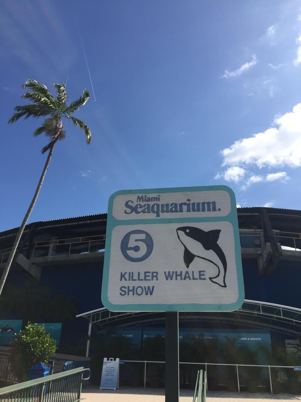 A sign advertises the parks killer whale show