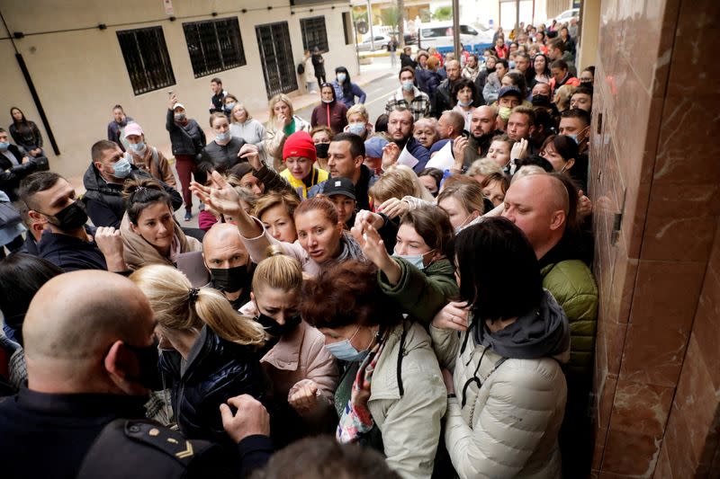 FILE PHOTO: Ukrainian refugees queue to apply for temporary protection approved by EU that allows residence and a work permit, in Torrevieja