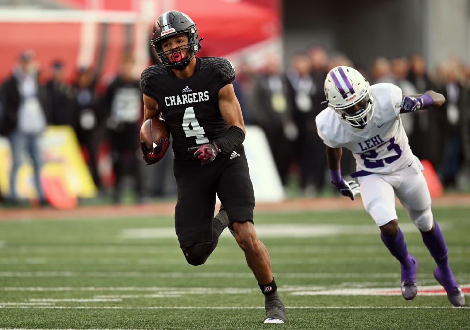 Corner Canyon’s Jerome Myles outruns Lehi’s Isaiah Allen for a score as they play in high school football semifinal action at Rice-Eccles Stadium in Salt Lake City on Friday, Nov. 10, 2023. | Scott G Winterton, Deseret News