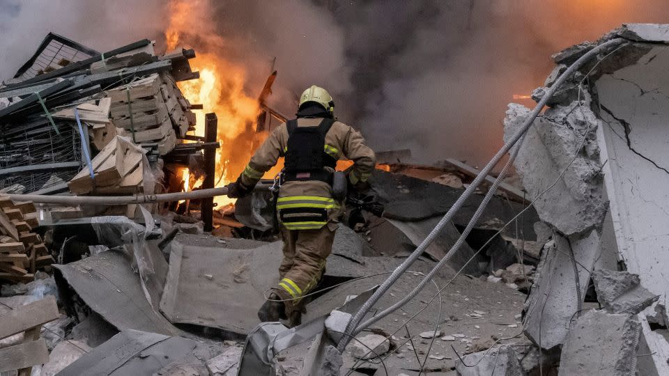 A firefighter arrives at the scene of a Russian missile strike in Kharkiv, December 29, 2023. - Yevhen Titov/Reuters