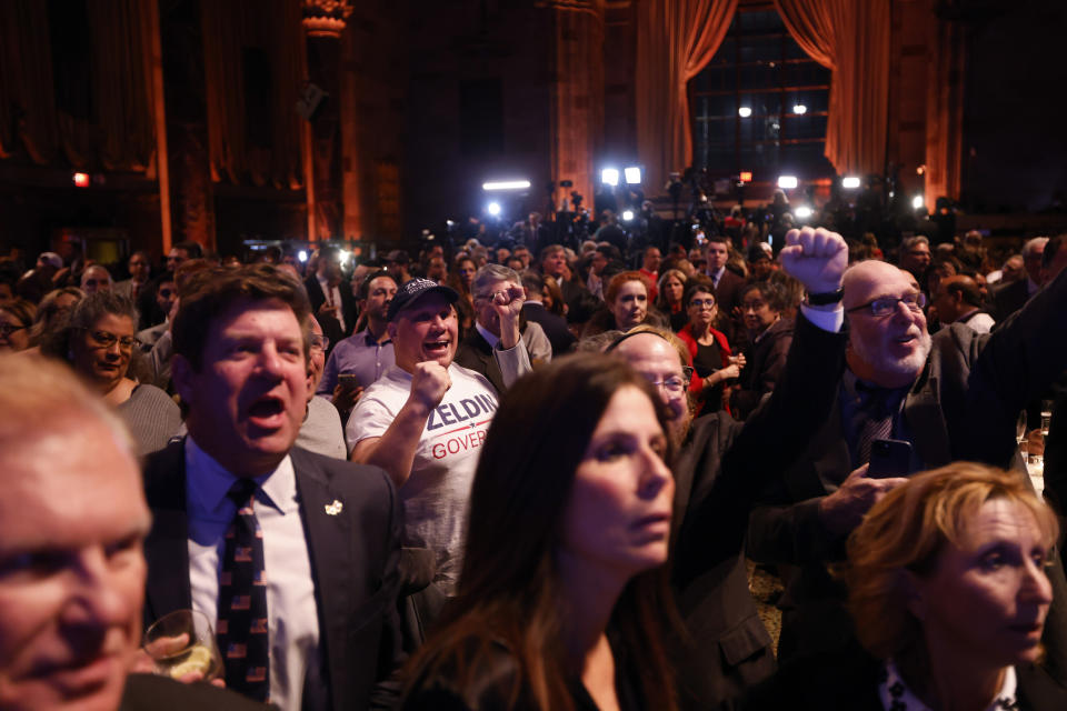 Supporters of Republican gubernatorial candidate Lee Zeldin watch results come in at his election night party Tuesday, Nov. 8, 2022, in New York. (AP Photo/Jason DeCrow)