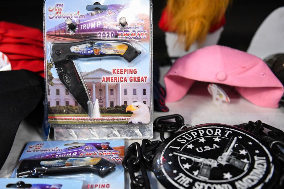 Joe Prince, 48, sells Trump merchandise from his mobile shop near the South Carolina State Fairgrounds after the 56th annual Silver Elephant Gala, where Trump was the keynote speaker, in Columbia, S.C., on Saturday, Aug. 5, 2023.