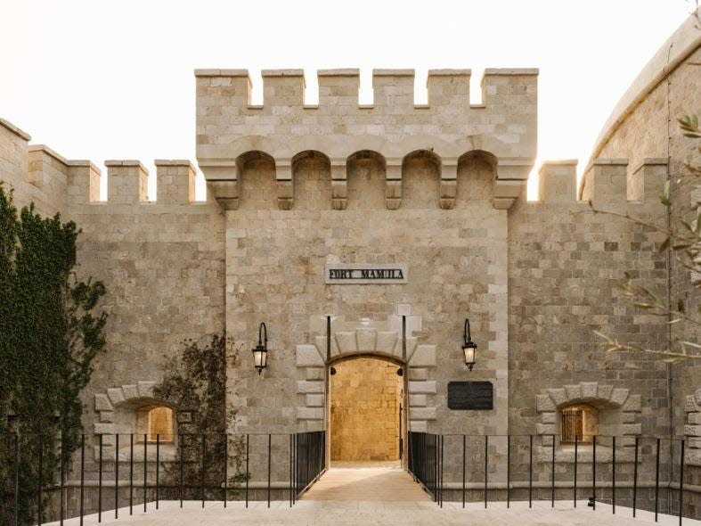 An entrance into Mamula Island Hotel. The sign reads Fort Mamula.