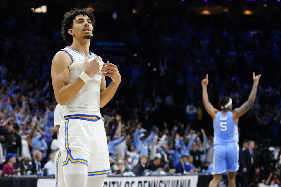 UCLA's Jules Bernard, left, reacts after UCLA lost a college basketball game against North Carolina in the Sweet 16 round of the NCAA tournament, Friday, March 25, 2022, in Philadelphia. (AP Photo/Chris Szagola)